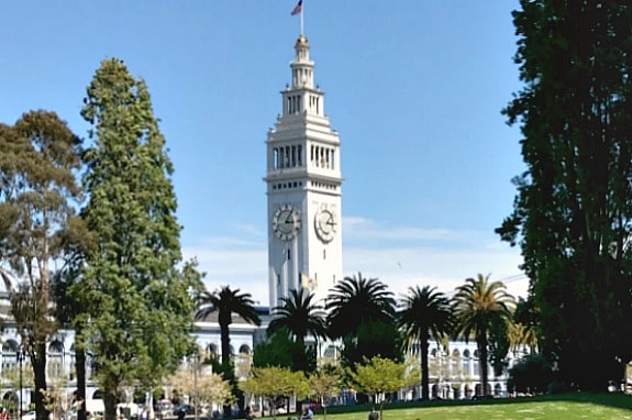 A large clock tower towering over a city