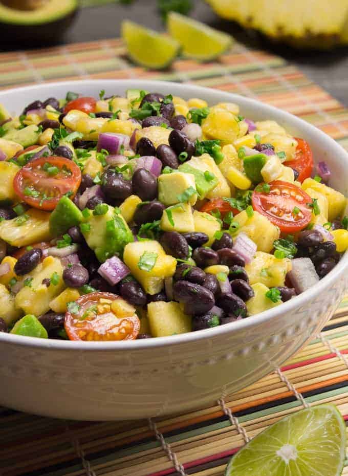 a pineapple fiesta salad that is part of the 15 cold summer salads
