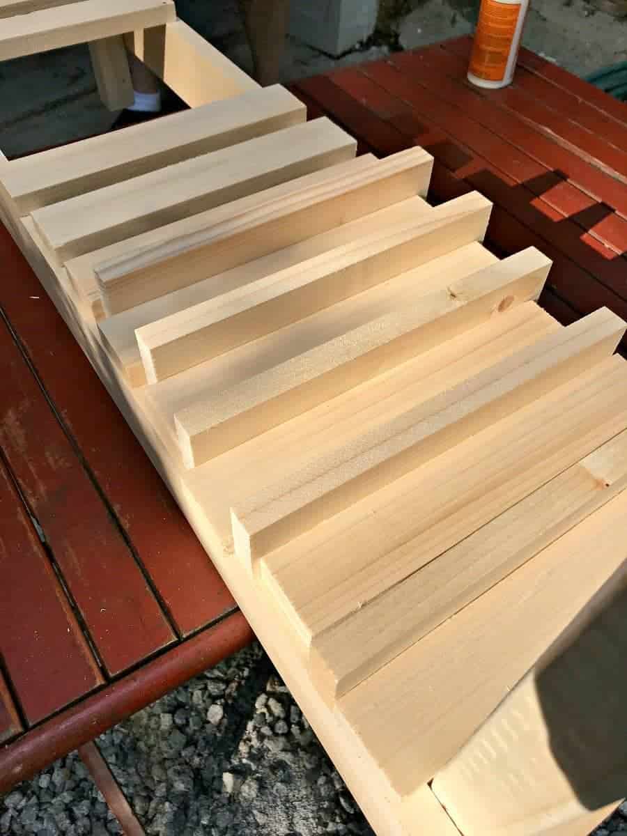 attaching slats on shelf of DIY wood planter