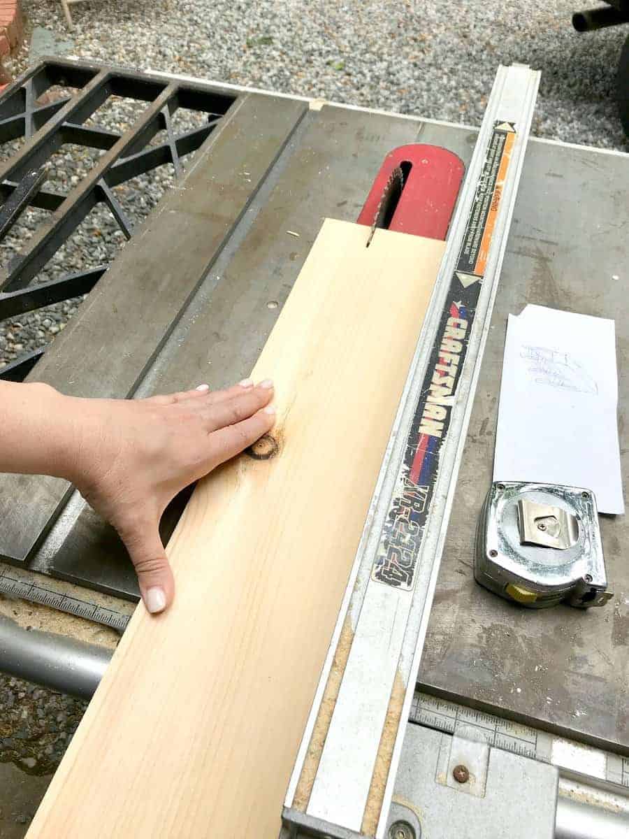 cutting wood on table saw for DIY wood planter