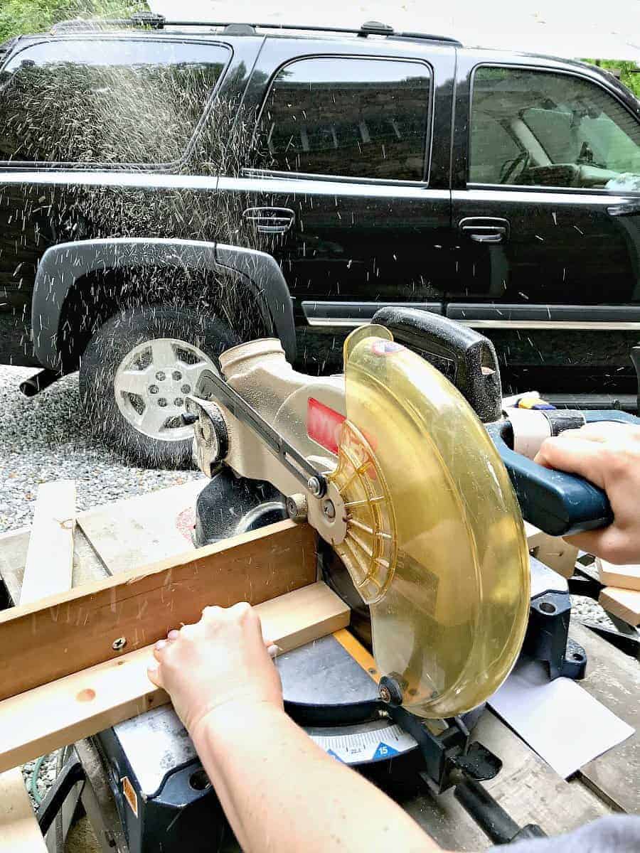 cutting slats for DIY wood planter on chop saw