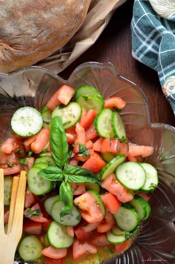 an italian tomato and cucumber salad that is part of the 15 cold summer salads