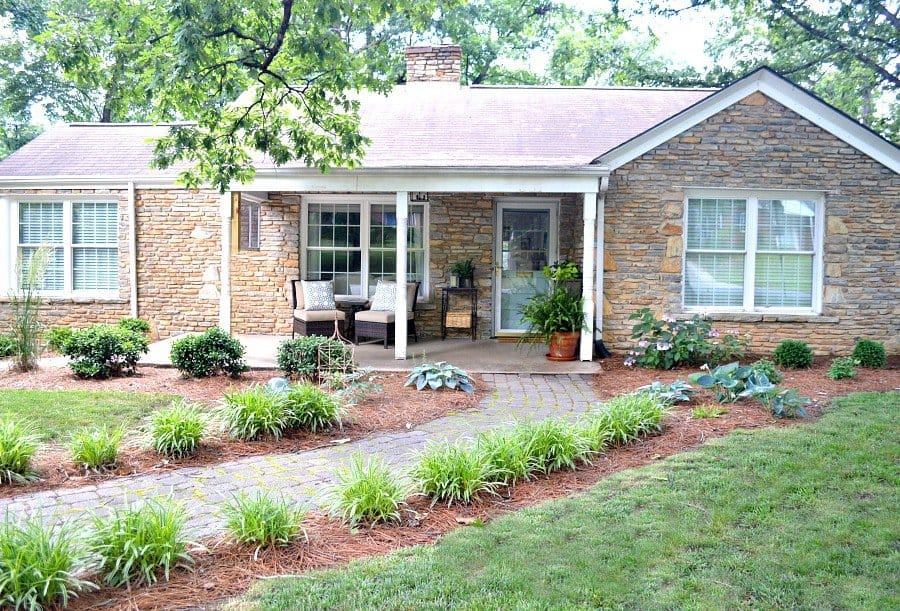 front of stone cottage with covered porch