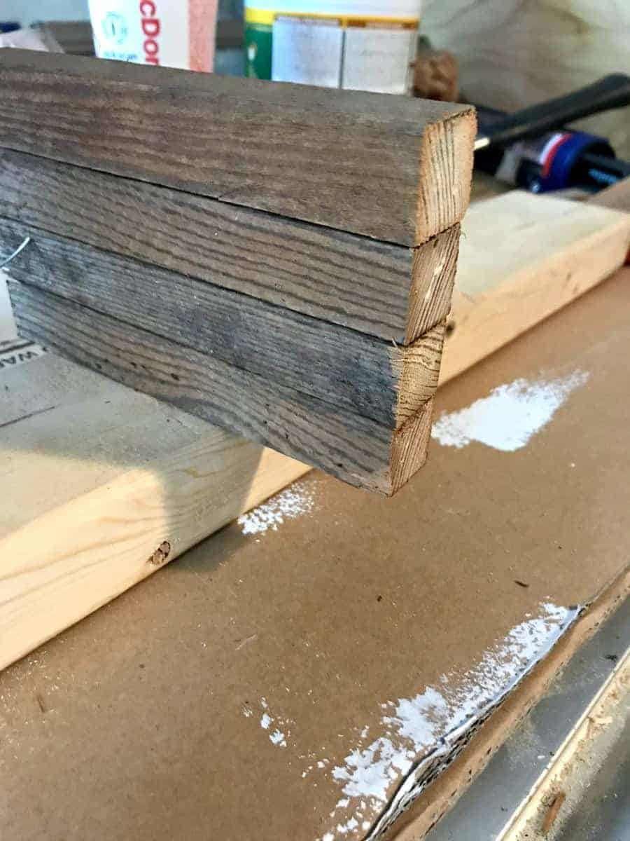 tobacco sticks nailed together to make the top of a wooden garden obelisk