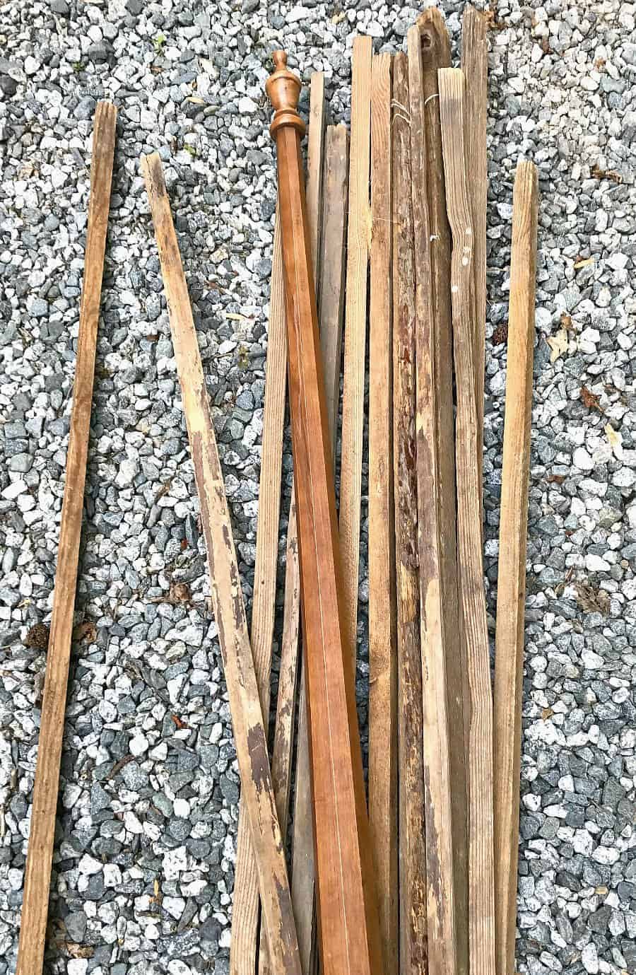 scrap wood tobacco sticks laying on the stone driveway