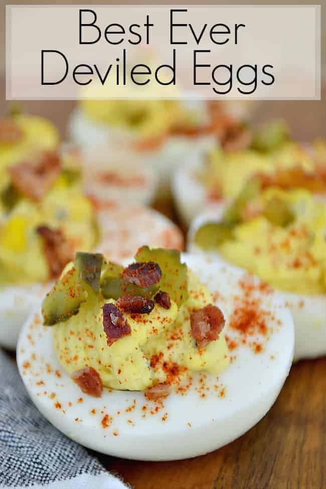 best ever deviled eggs on a cutting board with a dishtowel