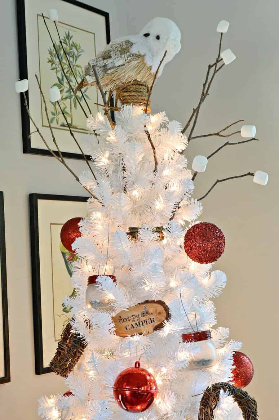 white Christmas tree decorated in a camping theme with DIY mason jar lanterns