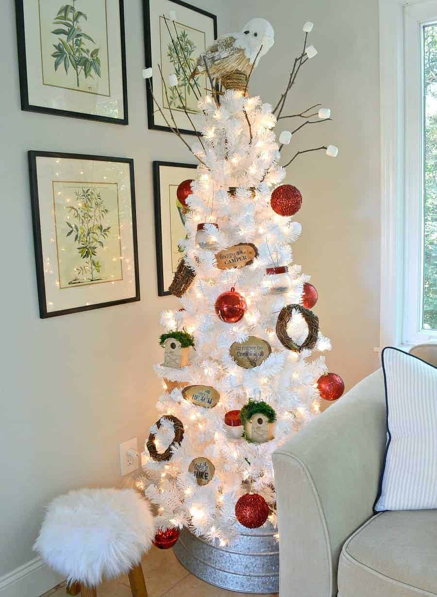 white Christmas tree decorated in a camping in the mountains theme with DIY mason jar lanterns