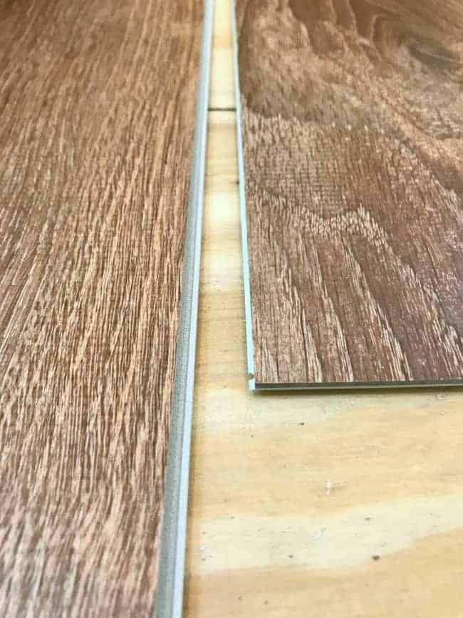 tongue and groove ends of vinyl plank flooring