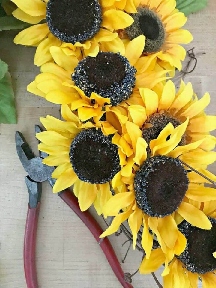 How toDIY Sunflower Wreath (in Under 30 Minutes) Make a Sunflower Wreath (in Under 30 Minutes) photograph finishing wreath for a how to make a sunflower wreath tutorial