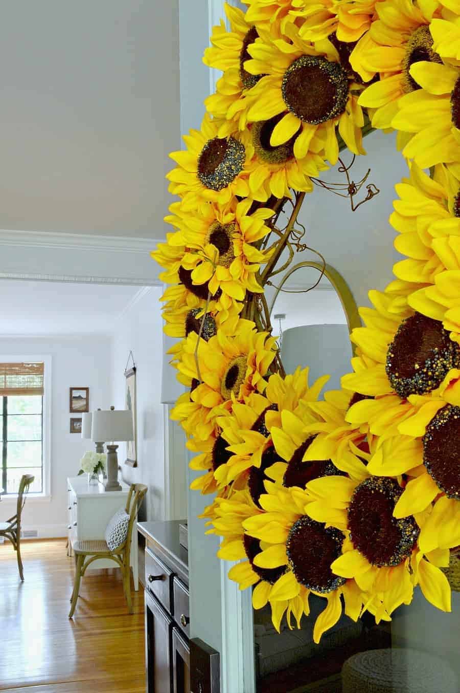 DIY sunflower wreath on front door, looking in cottage