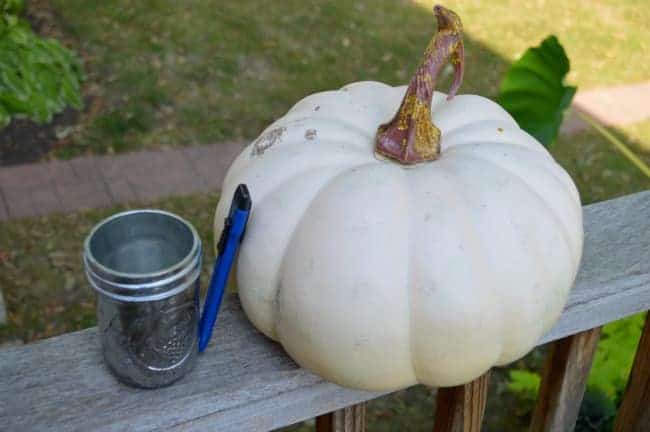 faux pumpkin, razor knife, and small mason jar