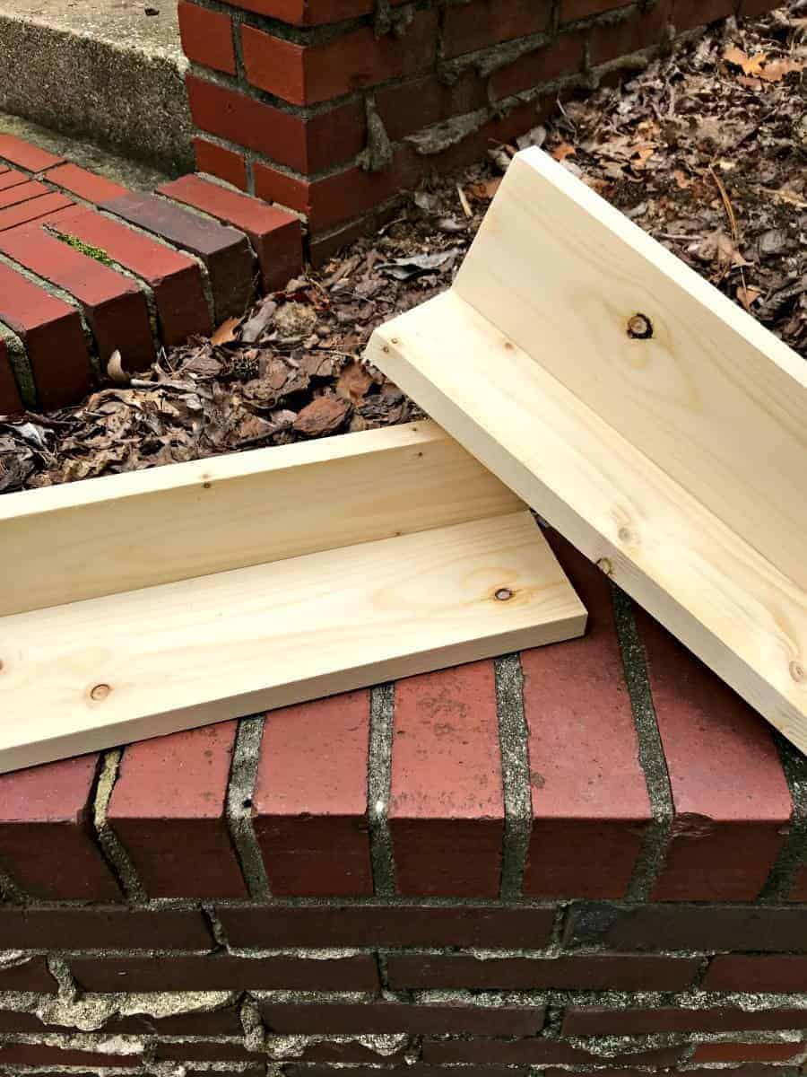 2 shelves built out of pine to make a wall mounted coat rack