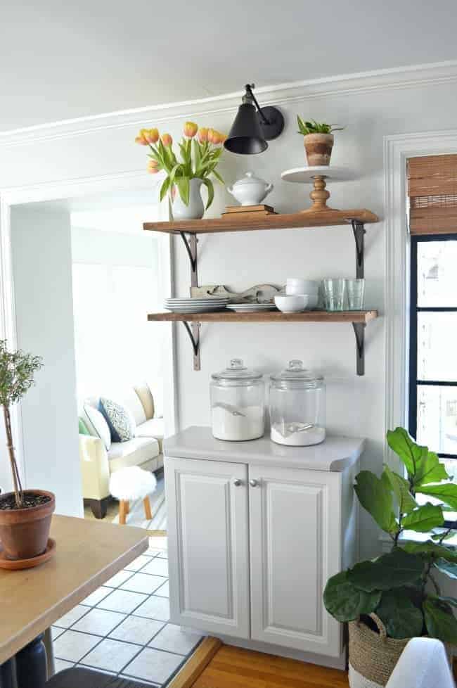 open shelves with dishes on kitchen wall 