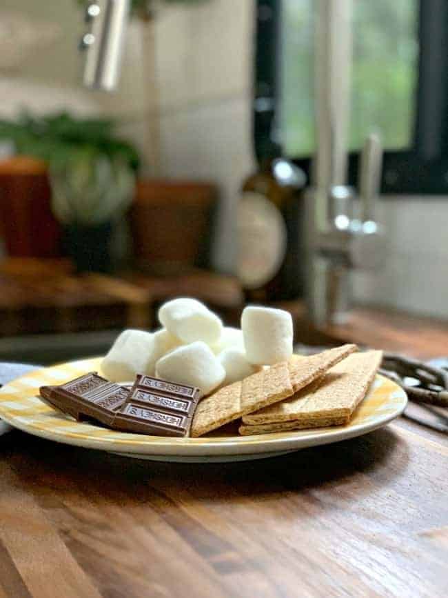 plate of s'more fixings on butcher block countertop for RV remodel update