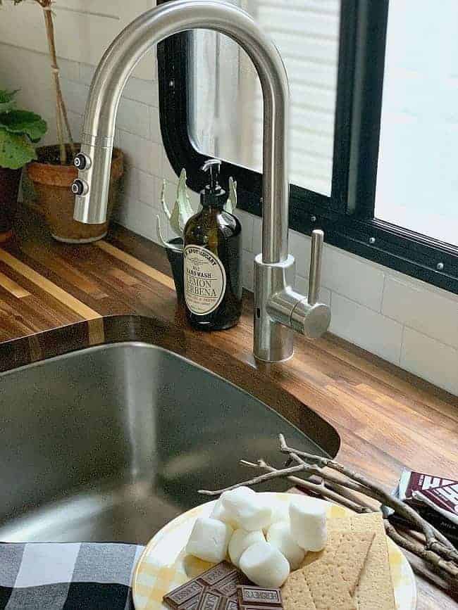 faucet and butcher block countertop in RV