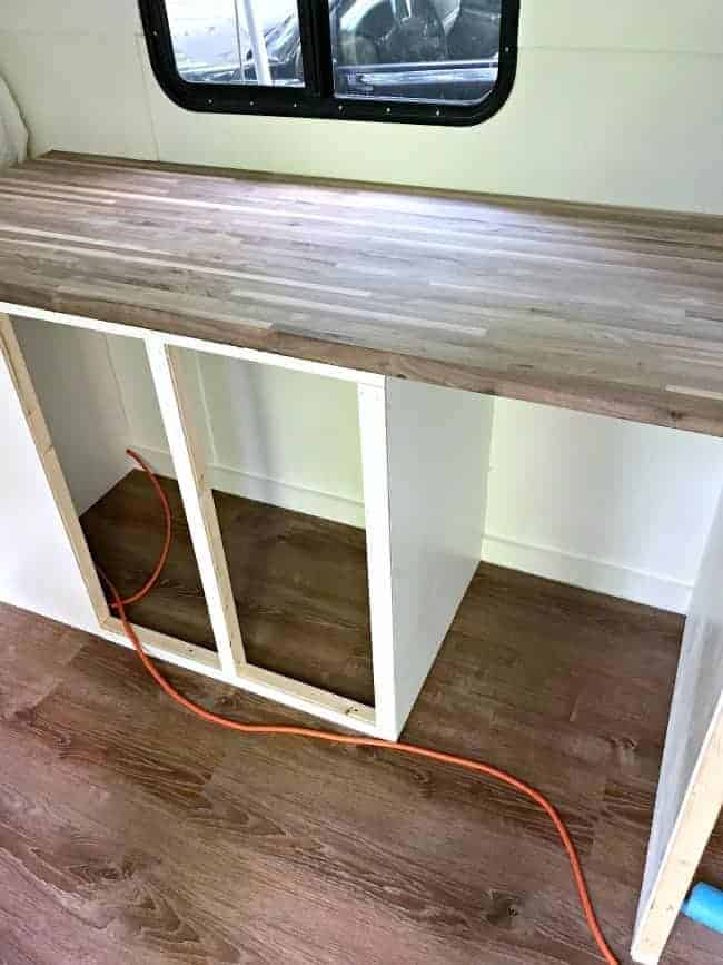 new butcher block countertop on framed kitchen cabinets for rv remodel update