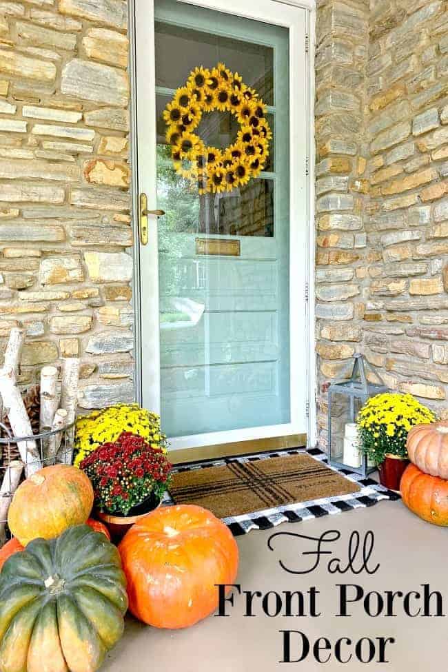 fall front porch with pumpkins