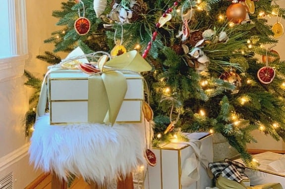 wrapped gift sitting on furry stool