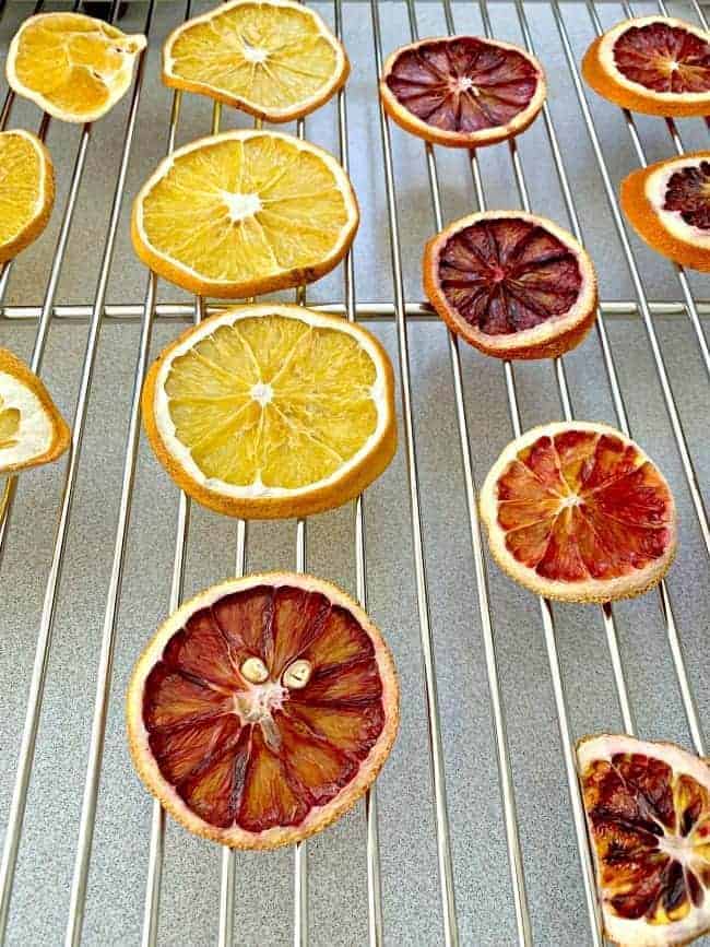 dried orange and blood orange slices on cookie cooling rack