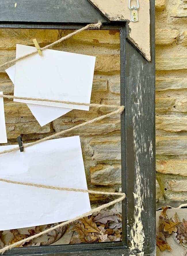 back view of DIY black memo board with twine 