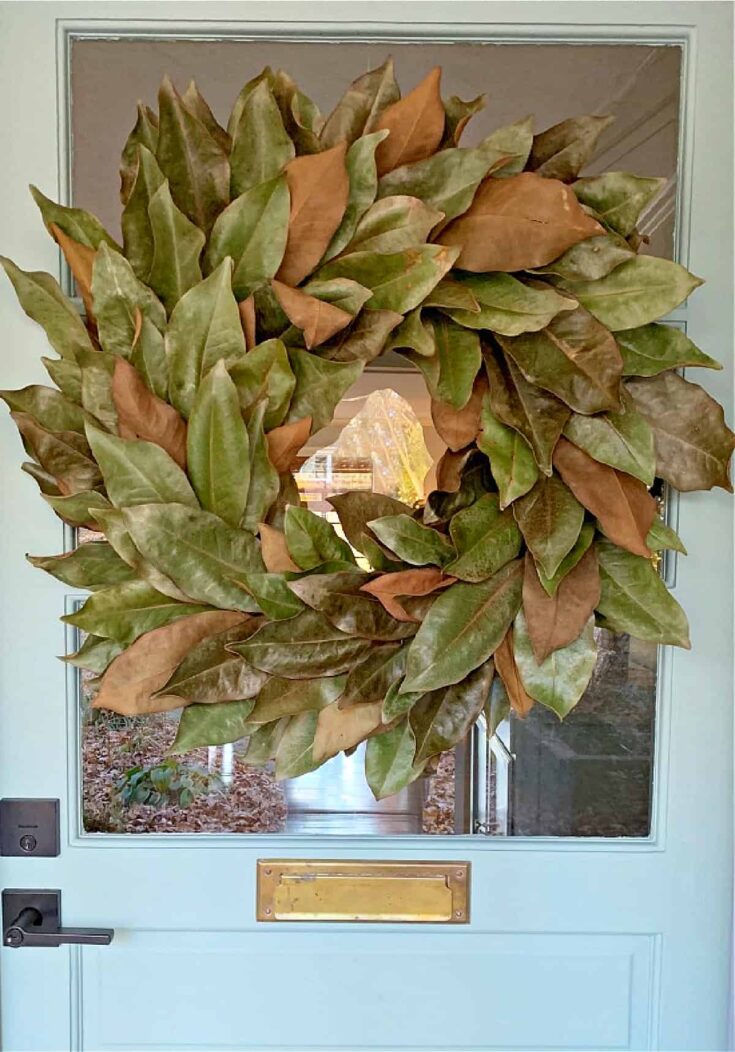 magnolia leaf wreath on blue door