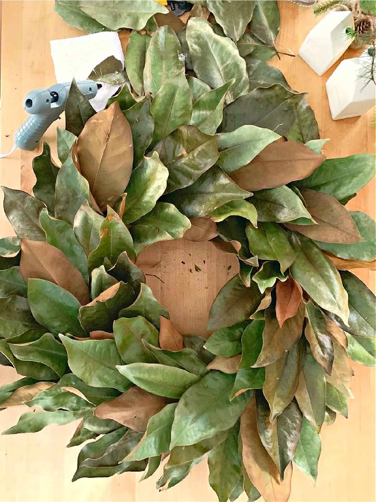 magnolia leaf wreath on table