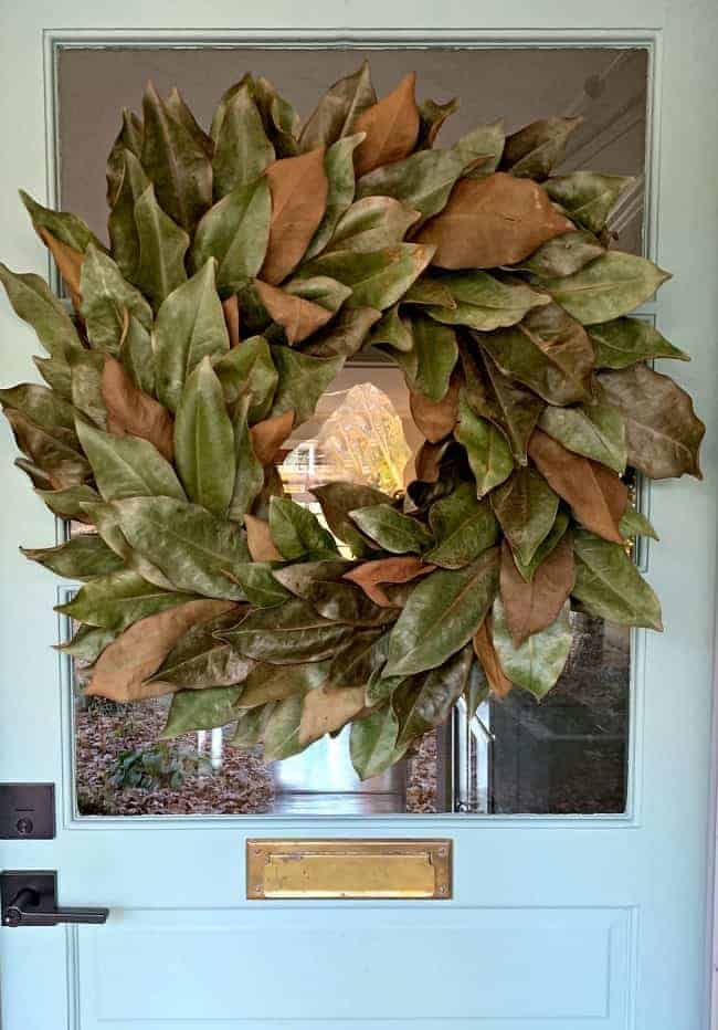 magnolia leaf wreath on blue door