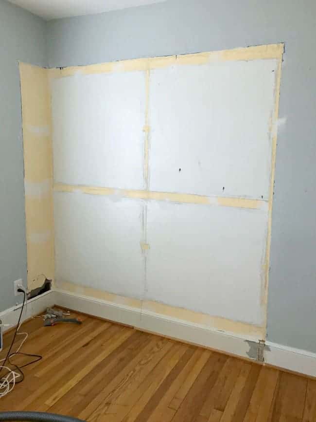 damaged wall in small bedroom