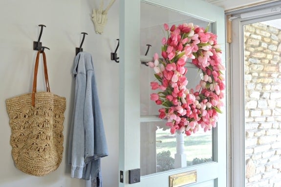 tulip wreath hanging on farmhouse front door