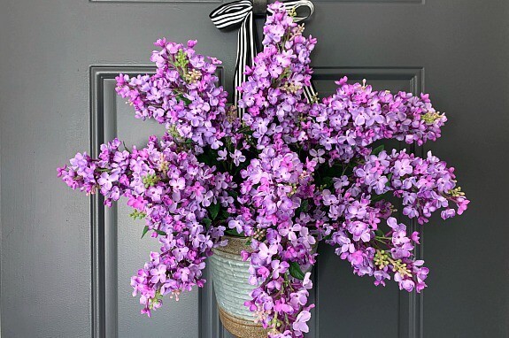 A bouquet of lilacs on a door