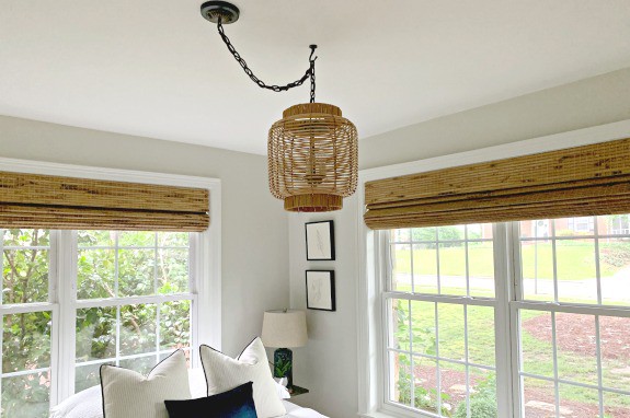 DIY hanging lamp made from a rattan lantern in guest bedroom