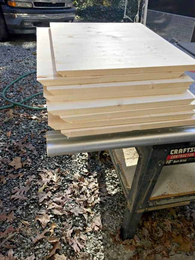 pine panels on table saw for DIY storage ottomans