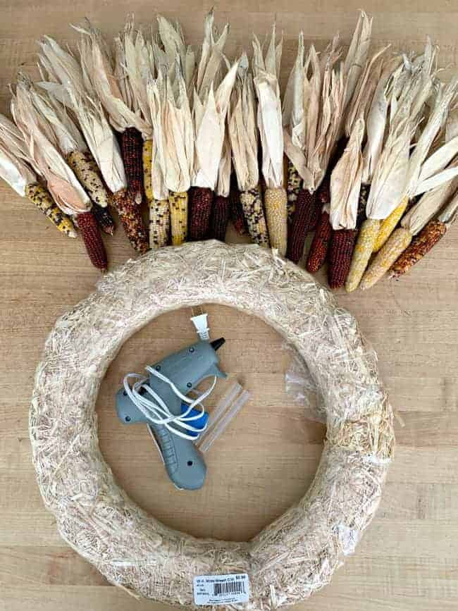 DIY Indian Corn Wreath pix supplies to make DIY Indian corn wreath, hot glue gun, glue sticks, straw wreath form and mini corn cobs