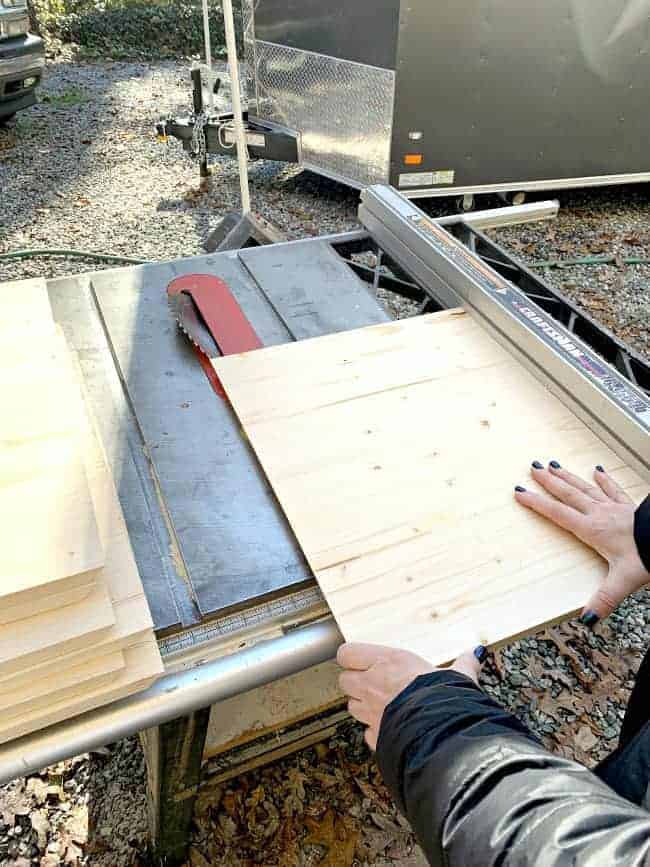 cutting pine plank on table saw