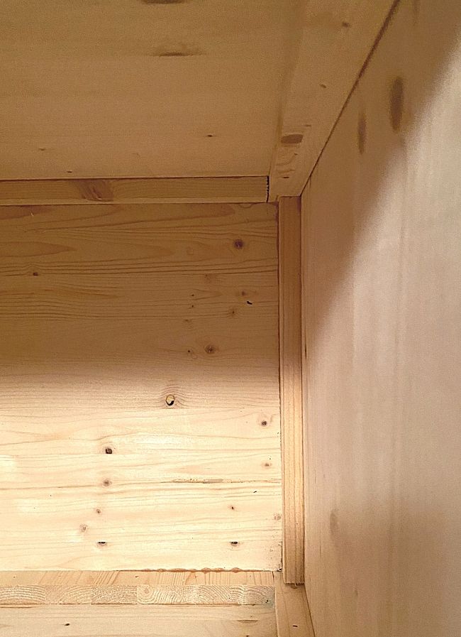 inside view of wood storage box supports