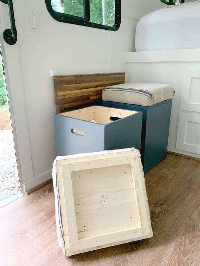 lid of DIY storage ottoman on floor with view of inside box