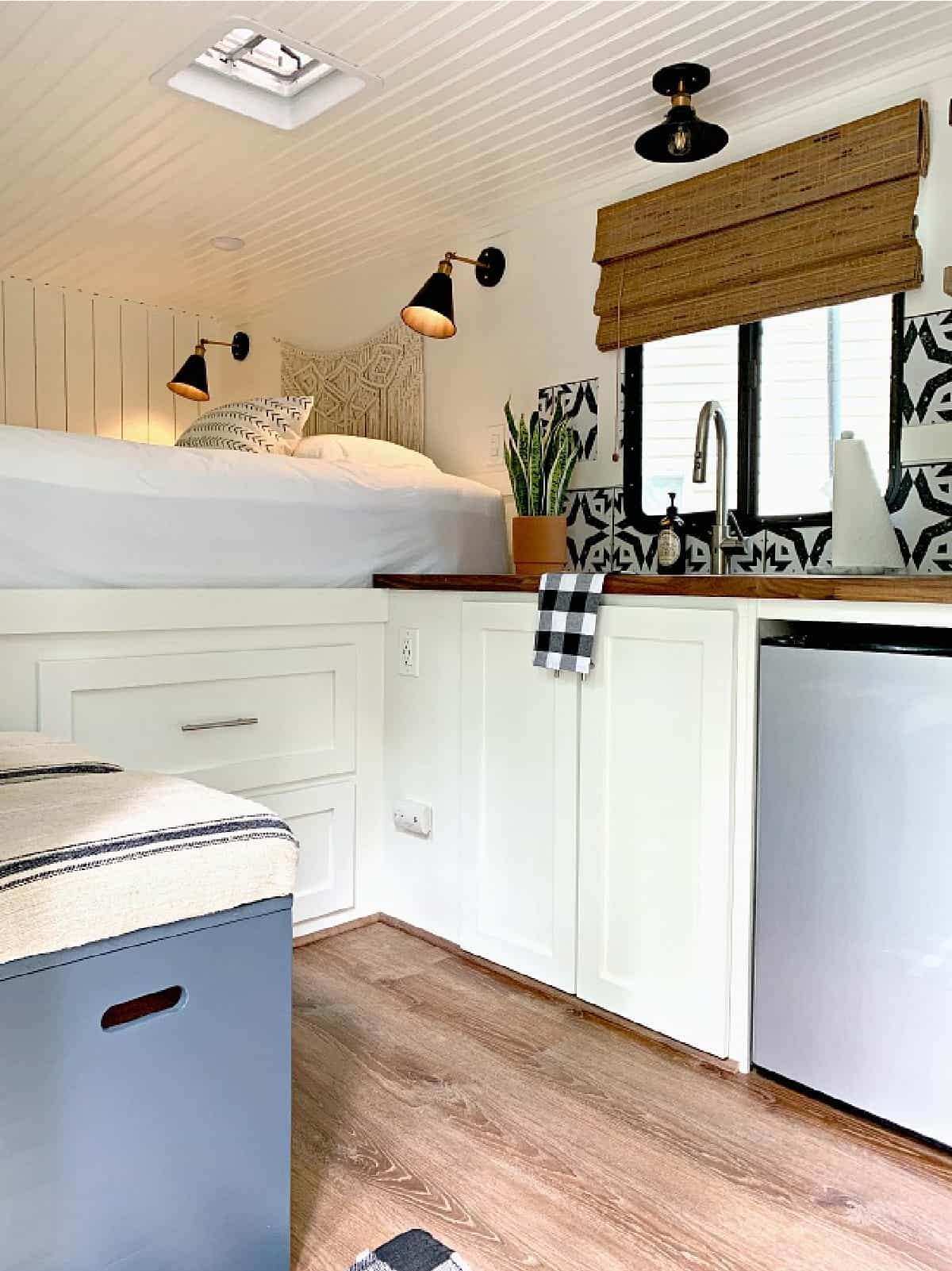 view inside of small RV with white cabinets