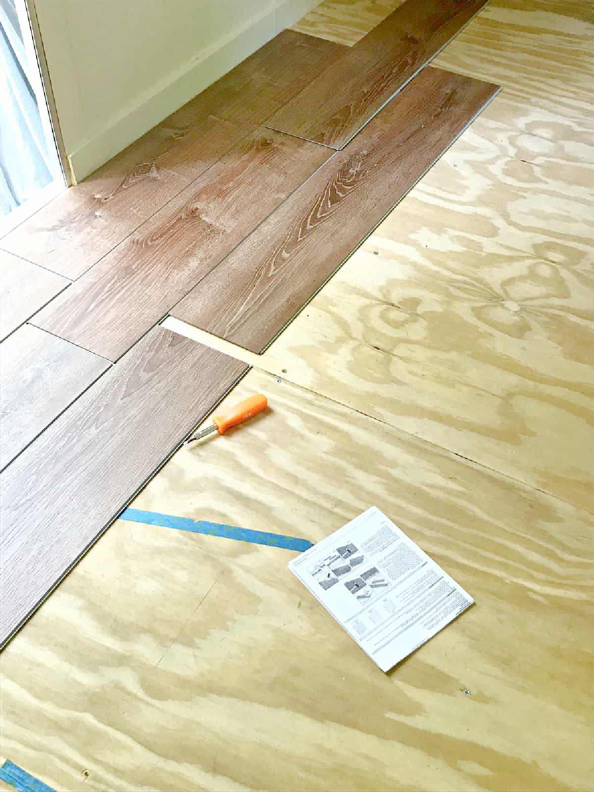 vinyl planks being installed in an RV