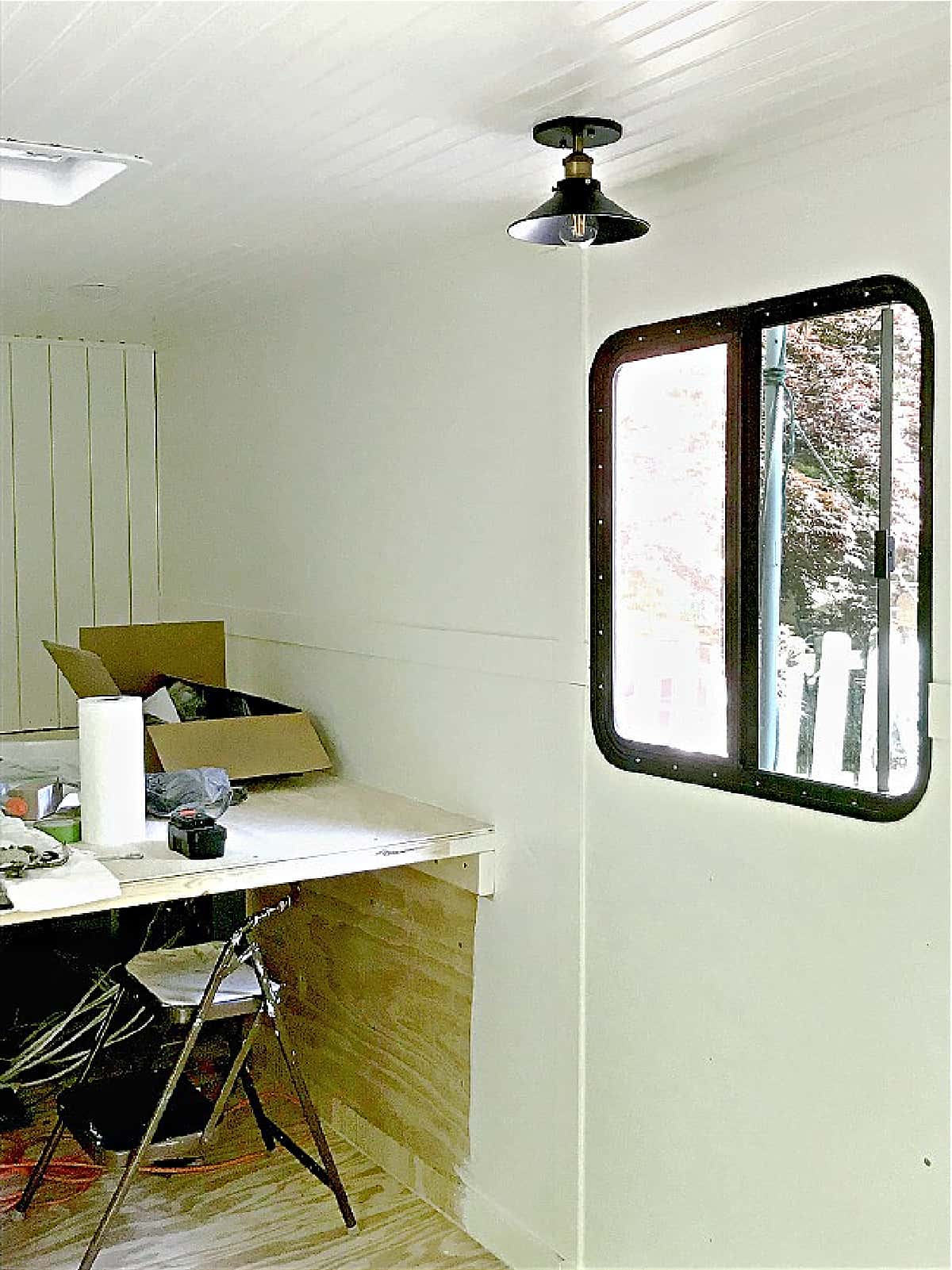 bright white painted walls and window in cargo trailer