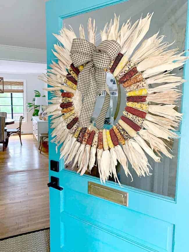 DIY Indian Corn Wreath after image mini Indian corn wreath hanging on turquoise front door