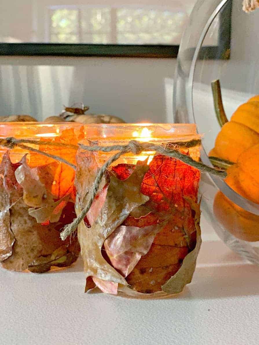 fall leaf candle holders on white buffet