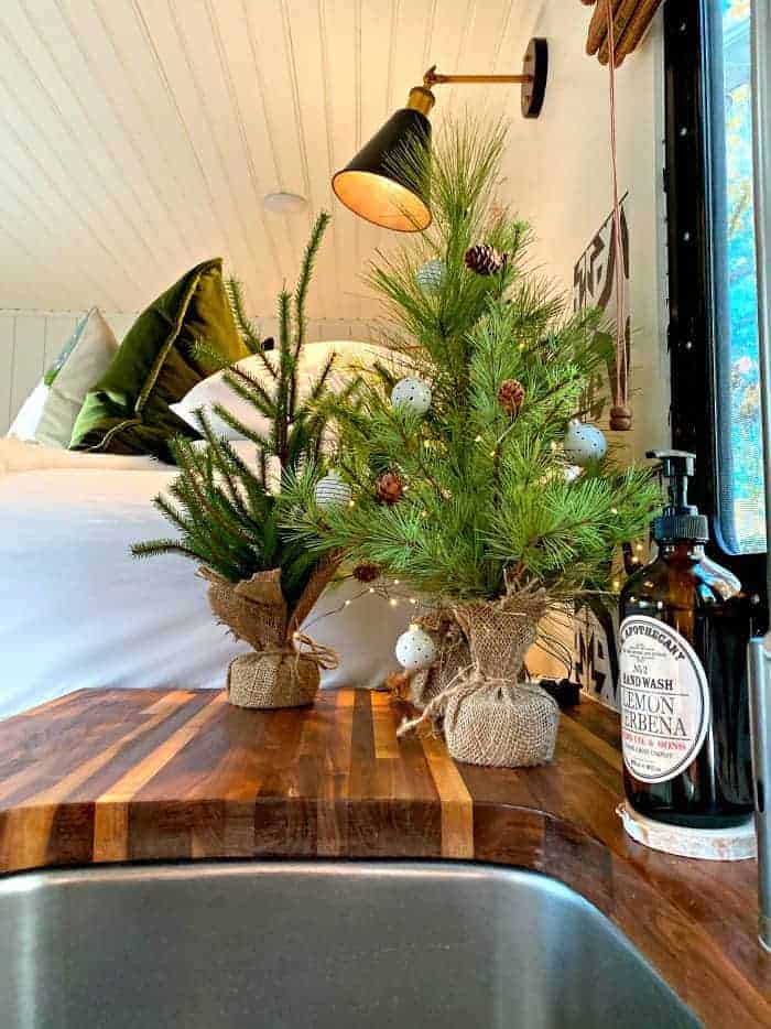 faux Christmas trees on counter in RV