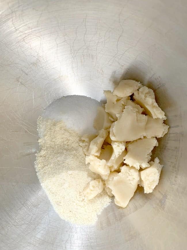 sugar, flour and almond paste in a mixing bowl