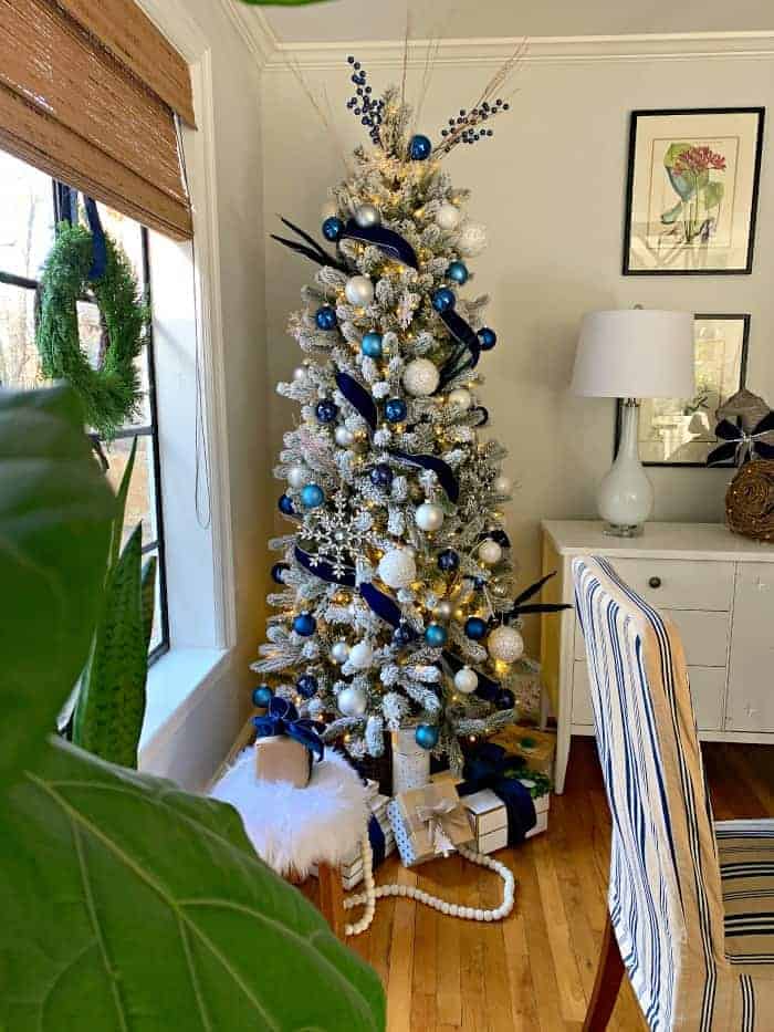 navy Christmas tree in corner of dining room