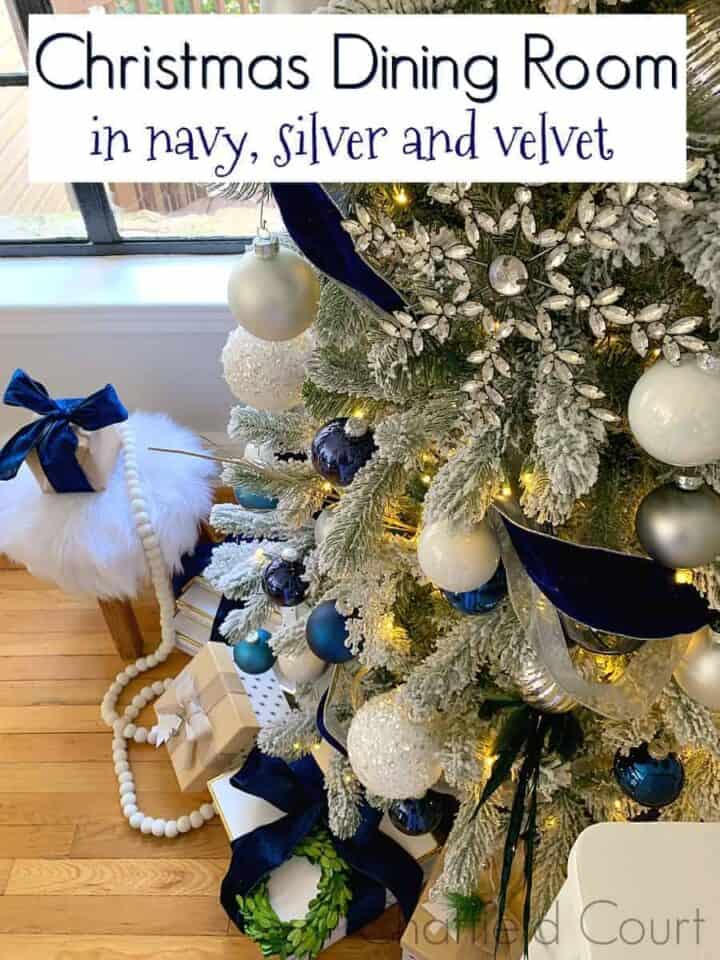 bottom view of flocked Christmas tree decorated in navy and silver, and a large graphic