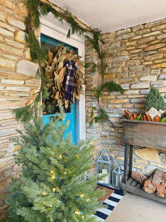 view of front door with magnolia leaf wreath