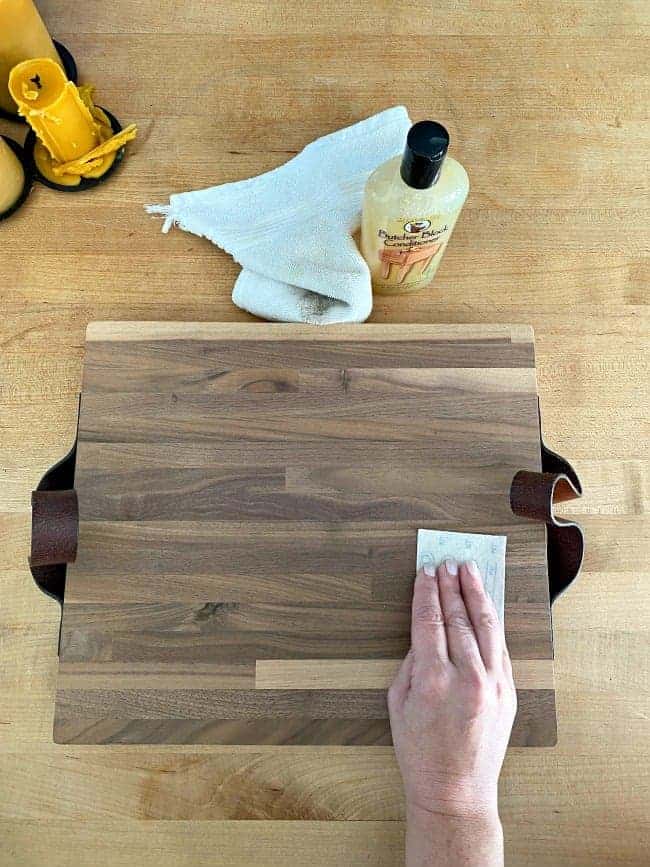 sanding down DIY butcher block cutting board