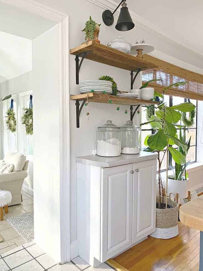 barn wood shelves with dishes on them in kitchen