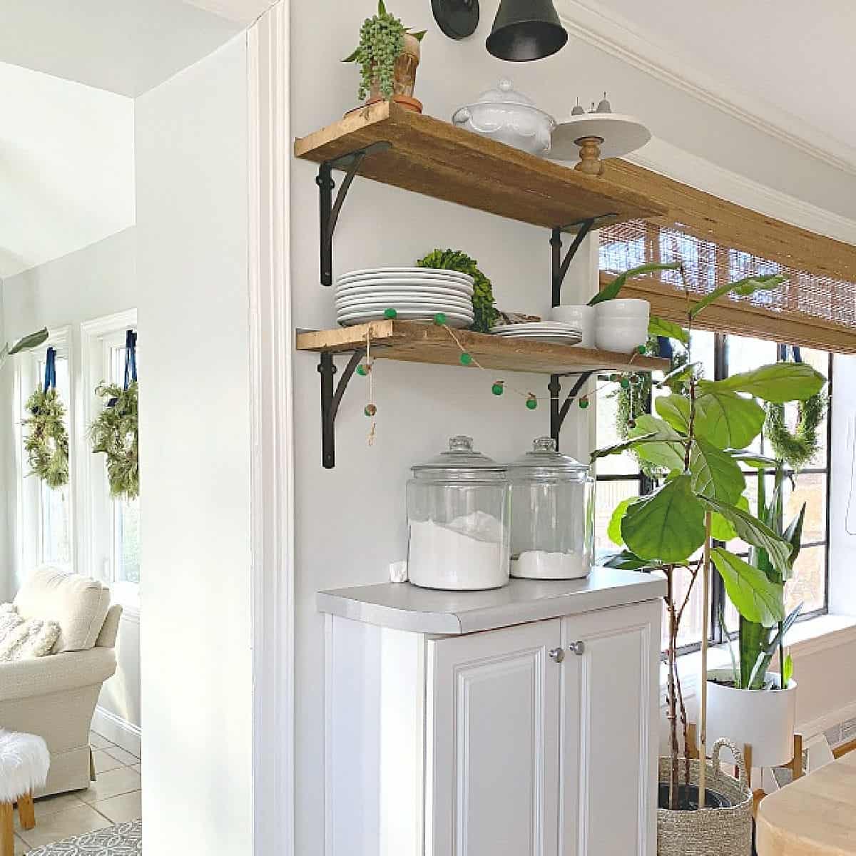 barn wood shelves with dishes on them in kitchen